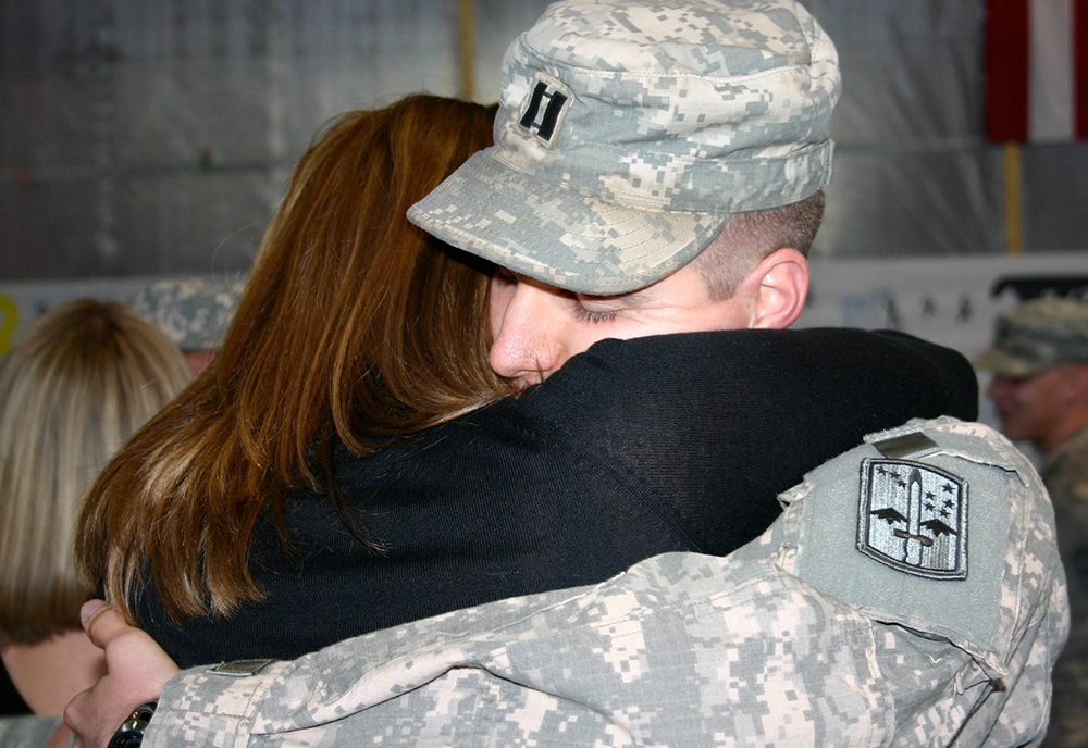 Samantha Tromly and Kevin Tromly embrace after deployment